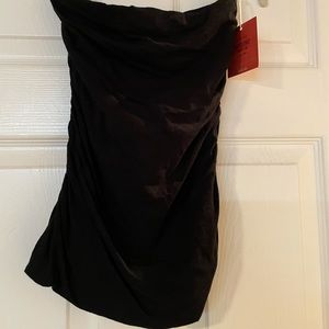 Black sleeveless top.